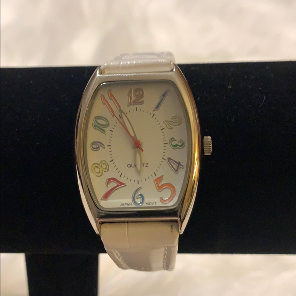 Watch with colorful numerals with white strap